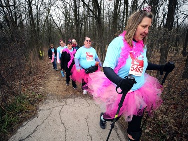 Kellea Small (right) leads a colourful group along a trail in the Bois-des-esprits urban forest in Royalwood during the Winnipeg Run for Women, held at Centre scolaire Leo-Remillard in Winnipeg, on Sun., May 12, 2019. There were over 1,600 people registered to participate, with pledges and donations supporting mental health programs at Mood Disorders Association of Manitoba. Kevin King/Winnipeg Sun/Postmedia Network