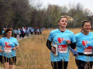 Deidre Longley (right) and daughter Ceara Lebedeff take part in the Winnipeg Run for Women, held at Centre scolaire Leo-Remillard in Winnipeg, on Sun., May 12, 2019. There were over 1,600 people registered to participate, with pledges and donations supporting mental health programs at Mood Disorders Association of Manitoba. Kevin King/Winnipeg Sun/Postmedia Network