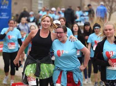 Participants mug for the camera during the Winnipeg Run for Women, held at Centre scolaire Leo-Remillard in Winnipeg, on Sun., May 12, 2019. There were over 1,600 people registered to participate, with pledges and donations supporting mental health programs at Mood Disorders Association of Manitoba. Kevin King/Winnipeg Sun/Postmedia Network