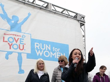 Aly Raposo, women's programming and youth director with the Mood Disorders Association of Manitoba, addresses the crows for the Winnipeg Run for Women, held at Centre scolaire Leo-Remillard in Winnipeg, on Sun., May 12, 2019. There were over 1,600 people registered to participate, with pledges and donations supporting mental health programs at MDAM. Kevin King/Winnipeg Sun/Postmedia Network