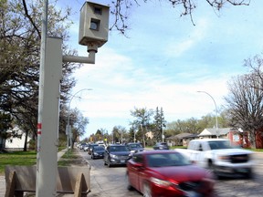 Traffic flows past an intersection safety camera on Corydon Avenue north of Kenaston Boulevard in Winnipeg on Tuesday.