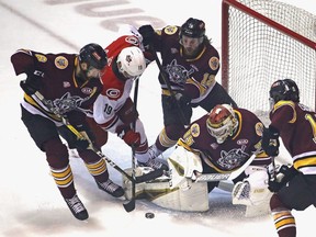 ROSEMONT, ILLINOIS - JUNE 08: Oscar Dansk #35 of the Chicago Wolves makes a save against Morgan Geekie #19 of the Charlotte Checkers as Griffin McKenzie #6 (L) and Ryan Wagner #12 (R) defend during game Five of the Calder Cup Finals at Allstate Arena on June 08, 2019 in Rosemont, Illinois. (Photo by Jonathan Daniel/Getty Images)