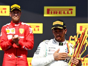 Race winner Lewis Hamilton of Great Britain and Mercedes GP celebrates on the podium as second placed Sebastian Vettel of Germany and Ferrari applauds during the F1 Grand Prix of Canada at Circuit Gilles Villeneuve on Sunday, June 09, 2019, in Montreal.