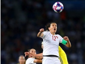 Christine Sinclair of Canada wins a header during the 2019 FIFA Women's World Cup France Round Of 16 match between Sweden and Canada at Parc des Princes on June 24, 2019 in Paris, France.