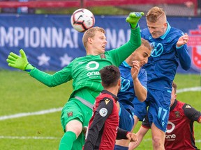 HFX Wanderers FC Attacker Tomasz Skublak gets a header by Valour FC goalkeeper Tyson Farago during last week's game. (Trevor MacMillan/CPL)