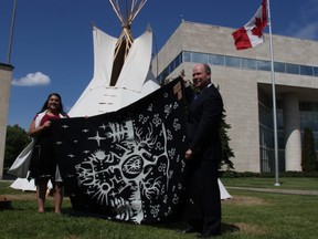Connected North spokesperson Tanjit Nagra (left) presents a star blanket to Jeff Macoun, president and COO of Canada Life, in appreciation of a $500,000 commitment from Canada Life to improve youth education in remote northern Manitoba communities. 
Danton Unger/Winnipeg Sun