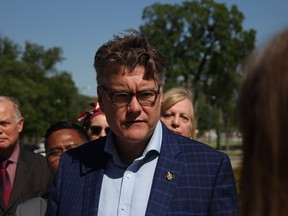 Manitoba Liberal leader Dougald Lamont announces a proposed province-run police service on the steps of the Manitoba Legislature on June 20, 2019.