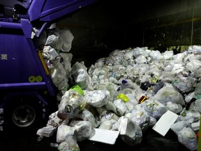A truck unloads plastic waste for recycling at Minato Resource Recycle Center in Tokyo, Japan June 10, 2019. Picture taken June 10, 2019.   REUTERS/Kim Kyung-Hoon