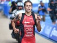 Canada's Tyler Mislawchuk of Oak Bluff, Man., prevailed in sticky, humid conditions on Friday to win Tokyo's International Triathlon Union (ITU) Olympic qualifying race, which also doubled as a Tokyo 2020 test event.