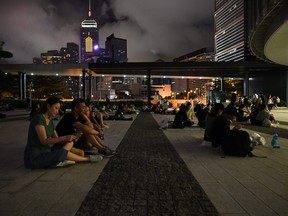 People sit in the Legislative Council Complex in support of demonstrators, who opposed the controversial extradition law, in Hong Kong on June 20, 2019. (HECTOR RETAMAL/AFP/Getty Images)