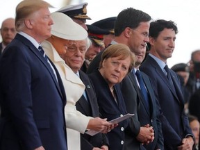 U.S. President Donald Trump, First Lady Melania, German Chancellor Angela Merkel, Dutch Prime Minister Mark Rutte and Canada's Prime Minister Justin Trudeau participate in an event to commemorate the 75th anniversary of D-Day, in Portsmouth, Britain, June 5, 2019. (REUTERS)