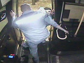 Bus driver Irvine Fraser (front) and passenger Brian Kyle Thomas are shown in Winnipeg in this 2017 still image from security video submitted into court as evidence.