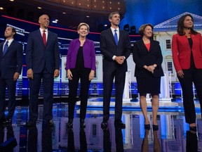 Democratic presidential hopefuls (from left) former U.S. Secretary of Housing and Urban Development Julian Castro, U.S. Senator from New Jersey Cory Booker, U.S. Senator from Massachusetts Elizabeth Warren, former U.S. Representative for Texas' 16th congressional district Beto O'Rourke, U.S. Senator from Minnesota Amy Klobuchar and U.S. Representative for Hawaii's 2nd congressional district Tulsi Gabbard arrive to participate in the first Democratic primary debate of the 2020 presidential campaign season hosted by NBC News at the Adrienne Arsht Center for the Performing Arts in Miami on June 26, 2019.