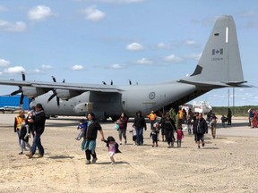 Hercules C-130 aircraft have been air lifting Pikangikum First Nation members out of the community to Sioux Lookout. Tim Brody/Sioux Lookout Bulletin