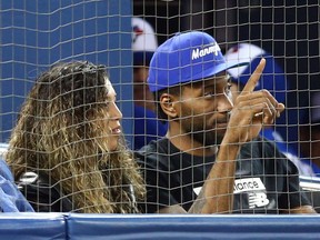 Kawhi Leonard of the Toronto Raptors acknowledges the crowd as he watches a MLB game between the Los Angeles Angels and the Toronto Blue Jays at Rogers Centre on June 20, 2019 in Toronto. (Vaughn Ridley/Getty Images)