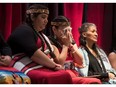 Lorelei Williams, centre, whose cousin Tanya Holyk was murdered by serial killer Robert Pickton, wipes away tears after responding to the report of the National Inquiry into Missing and Murdered Indigenous Women and Girls in Vancouver, on June 3.