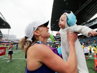 Nicole Walker, who lives in East St. Paul, Man.,, share a moment with her four-month old baby after crossing the finish line in third place in the Women's Full Marathon at the 41st annual Manitoba Marathon in Winnipeg, Man., on Sunday, June 16, 2019.