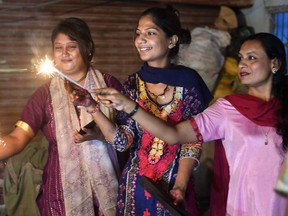 Pakistani Hindu women celebrate Diwali Festival in Karachi on Oct. 19, 2017.