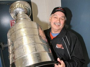 Former NHL player Reggie Leach poses for a photo with the Stanley Cup before the kickoff of the Reggie Leach Classic Hockey Tournament in Riverton, Manitoba, January 19, 2008. (Marcel Cretain/Postmedia Network files)