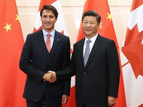 In this Aug. 31, 2016, file photo, Prime Minister Justin Trudeau shakes hands with Chinese President Xi Jinping ahead of their meeting at the Diaoyutai State Guesthouse in Beijing, China.