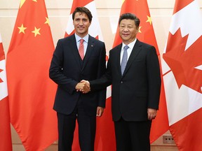 In this Aug. 31, 2016, file photo, Prime Minister Justin Trudeau shakes hands with Chinese President Xi Jinping ahead of their meeting at the Diaoyutai State Guesthouse in Beijing, China.