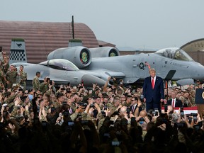 U.S. President Donald Trump reacts during his visit to U.S. troops based in Osan Air Base, South Korea June 30, 2019. (Ed Jones/REUTERS)