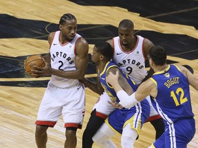 Toronto Raptors forward Kawhi Leonard, left, faces off against the State Warriors at the Scotiabank Arena in Toronto, Sunday June 2, 2019. (Veronica Henri /Toronto Sun/Postmedia Network)