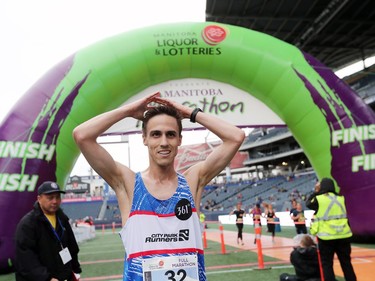 Winnipeg resident Paul Carr catches his breath after finishing in second place in the Men's Full Marathon at the 41st annual Manitoba Marathon in Winnpeg, Man., on Sunday, June 16, 2019.