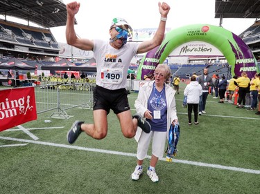 Winnipeg resident Peter Pazerniuk jumps in the air while in the finishing area at the 41st Manitoba Marathon as he shows his enthusaism for completing his 30th full marathon in under three hours. The 2019 Manitoba Marthon took place in Winnipeg, Man., on Sunday, June 16, 2019.