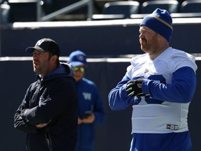 Pat Neufeld (right) watches Winnipeg Blue Bombers training camp with general manager Kyle Walters at IG Field on Sunday, May 19, 2019.