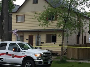 Winnipeg Fire Paramedic Service and Winnipeg Police Service vehicles at a scene of a fatal fire at a residence in the 500 block of Manitoba Avenue in Winnipeg on Saturday evening.