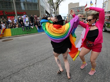 Two women dance at Portage and Main during the annual Pride parade through the streets of Winnipeg on Sun., June 2, 2019. Kevin King/Winnipeg Sun/Postmedia Network