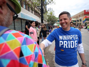 Mayor Brian Bowman shakes hands during the annual Pride parade through the streets of Winnipeg on Sun., June 2, 2019. Kevin King/Winnipeg Sun/Postmedia Network