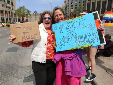 Two women with the same idea found each other during the annual Pride parade through the streets of Winnipeg on Sun., June 2, 2019. Kevin King/Winnipeg Sun/Postmedia Network