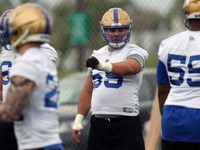 Centre Michael Couture makes his reads during Winnipeg Blue Bombers practice on the University of Manitoba campus on Tuesday. The Bombers O-line was outstanding in a 33-23 win over the Lions, opening huge holes for running back Andrew Harris, who racked up 148 yards, and giving quarterback Matt Nichols good time to throw the football.