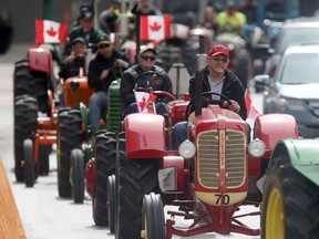The Manitoba Agricultural Museum presented a tractor parade through downtown Winnipeg Saturday.