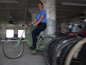Leigh Anne Parry, co-founder of Plain Bicycle Project, tries out one of the "omafiets" (Dutch for grandma bike) in their downtown Winnipeg warehouse on Monday.
