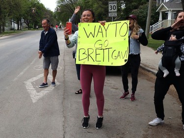 The cheering squad for full marathoner Brett Gavrailoff lets loose as he approaches during the Manitoba Marathon on Sun., June 16, 2019. Kevin King/Winnipeg Sun/Postmedia Network