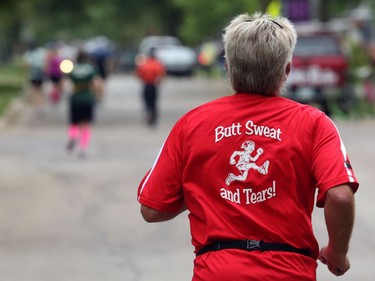 A member of the Butt Sweat and Tears relay team approaches Grosvenor Avenue on Guelph Street during the Manitoba Marathon on Sun., June 16, 2019. Kevin King/Winnipeg Sun/Postmedia Network