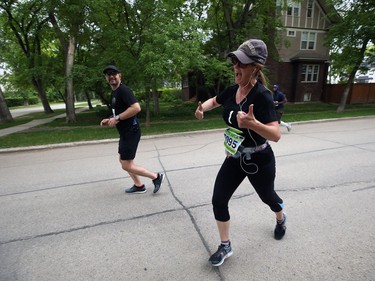 A member of the Crescentwood5 relay team mugs for the camera during the Manitoba Marathon on Sun., June 16, 2019. Kevin King/Winnipeg Sun/Postmedia Network