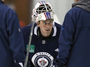 Goaltender Logan Neaton (centre) in conversation with coaches during Winnipeg Jets development camp at Bell MTS Iceplex on Tues., June 25, 2019. Kevin King/Winnipeg Sun/Postmedia Network