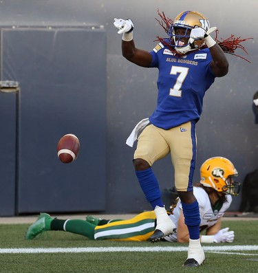 Winnipeg Blue Bombers receiver Lucky Whitehead revs his engine after a touchdown catch against the Edmonton Eskimos during CFL action in Winnipeg on Thurs., June 27, 2019. Linebacker Kevin Francis lies behind him. Kevin King/Winnipeg Sun/Postmedia Network