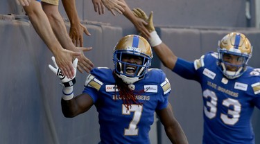 Winnipeg Blue Bombers receiver Lucky Whitehead and running back Andrew Harris celebrate a touchdown catch by Whitehead with fans during CFL action against the Edmonton Eskimos in Winnipeg on Thurs., June 27, 2019. Kevin King/Winnipeg Sun/Postmedia Network
