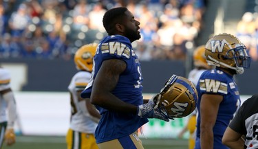 Winnipeg Blue Bombers receiver Chris Matthews puts his lid back on after taking a hit on an pass attempt during CFL action against the Edmonton Eskimos in Winnipeg on Thurs., June 27, 2019. Kevin King/Winnipeg Sun/Postmedia Network