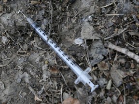 A discarded needle in a public place, in Osborne Village, in Winnipeg.