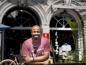 Alouettes head coach Khari Jones poses for photo outside the Mlle Catherine café in Old Montreal’s Place Jacques-Cartier on July 26, 2019.