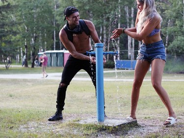 An impromptu water fight breaks out between Aaron Badescu and Alle Turner at the 46th annual Winnipeg Folk Festival at Birds Hill Provincial Park, north east of Winnipeg on Thursday, July 11, 2019. This  year's festival runs July 11 to 14, 2019.