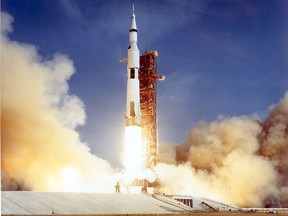 The Apollo 11 Saturn V space vehicle lifts off July 16, 1969, with astronauts Neil A. Armstrong, Michael Collins, and Edwin E. Aldrin aboard. )