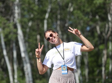 Beausejour, Man., resident Alyssa Kawukis gives peace signs as she volunteers with the media crew at the 46th annual Winnipeg Folk Festival at Birds Hill Provincial Park, north east of Winnipeg, Man., on Saturday, July 13, 2019. This year's Folk Festival runs July 11 to 14, 2019.
