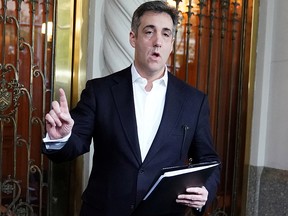 Michael Cohen, U.S. President Donald Trump's former lawyer, speaks to reporters as he leaves his apartment building to report to federal prison in the Manhattan borough of New York City, May 6, 2019.